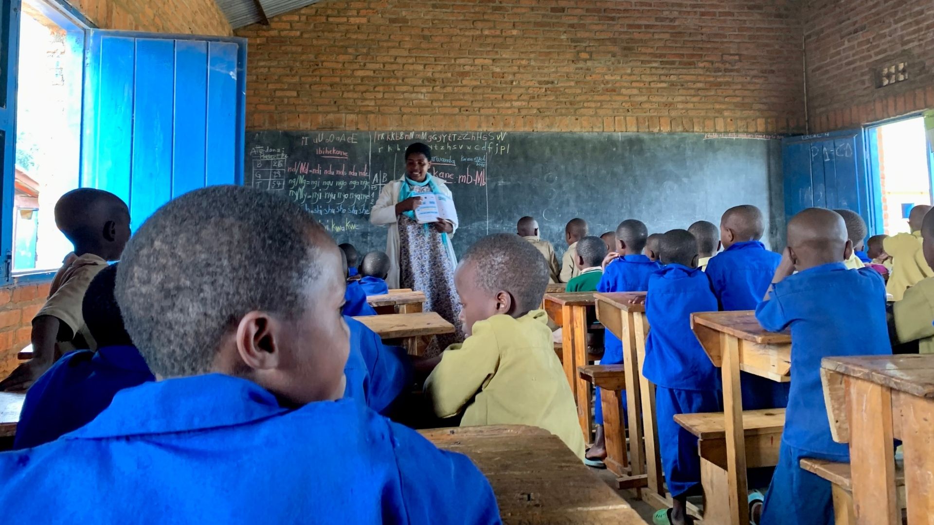Teacher Esther leading her classroom.